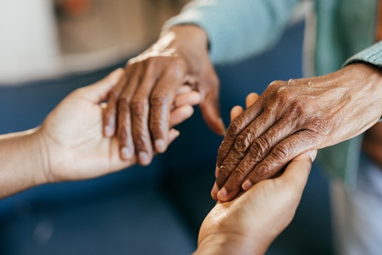 A close-up of hands holding each other in Glenview and Northshore, Chicago